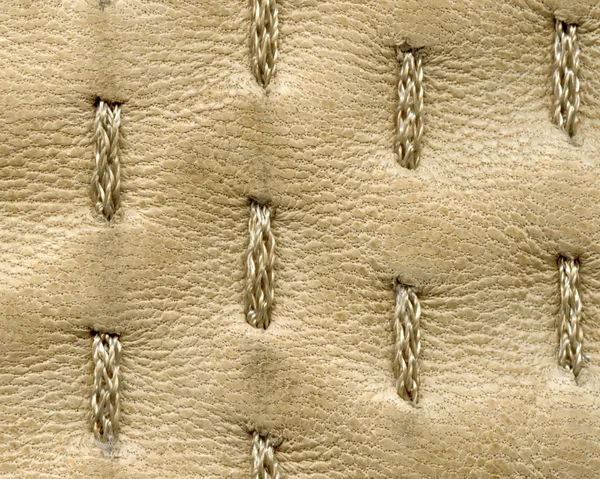 High detailed beige leather texture decorated with stitches — Stock Photo, Image