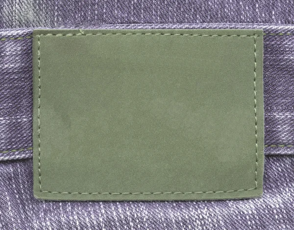 Green jeans leather label