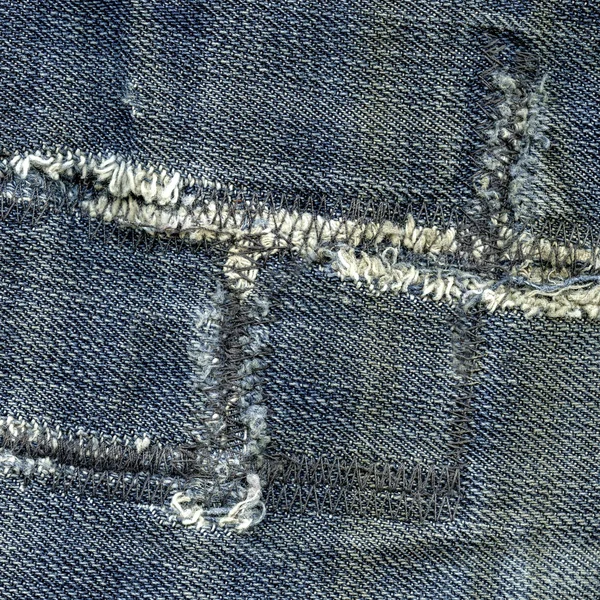 Старые изношенные джинсы текстуры — стоковое фото
