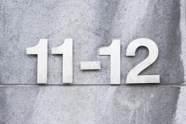 Numero 12-11 sul muro — Foto Stock