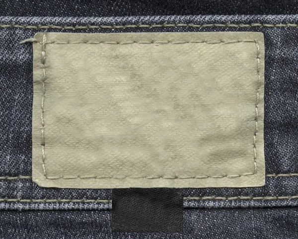 Blank leather label on jeans — Stock Photo, Image