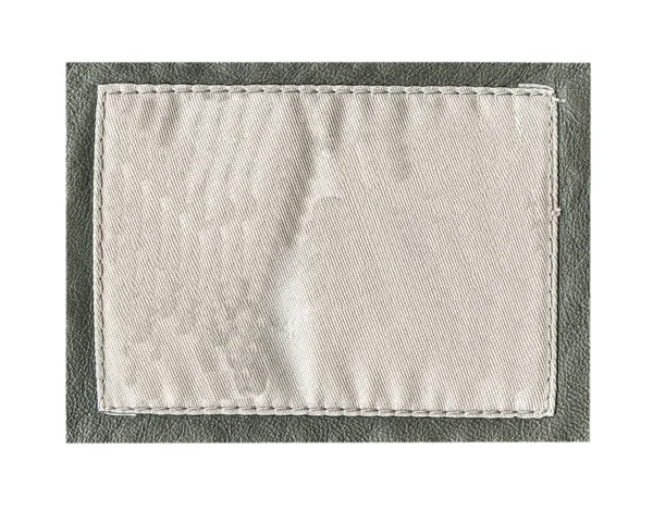 Crampled etiqueta têxtil com encanamento de couro — Fotografia de Stock