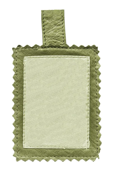 Etiqueta textil con tuberías de cuero verde — Foto de Stock