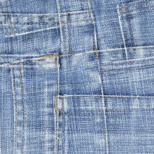 Фон из ломтиков джинсов — стоковое фото