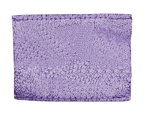 Etiqueta de cuero de vaqueros violeta envejecidos artificialmente en blanco — Foto de Stock