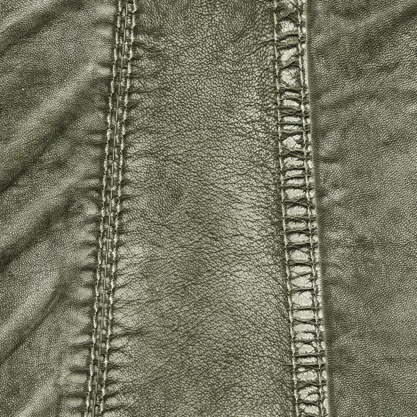 Fragment of green leather clothing — Stock Photo, Image