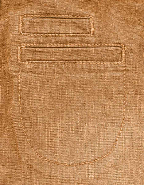 Fragment of yellow denim trousers — Stock Photo, Image