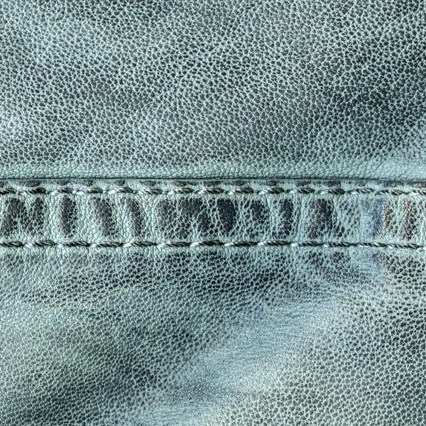 Groenig-blauwe leder texture, naad. — Stockfoto