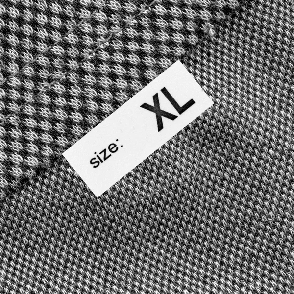 Textura do tecido, etiqueta, tamanho — Fotografia de Stock