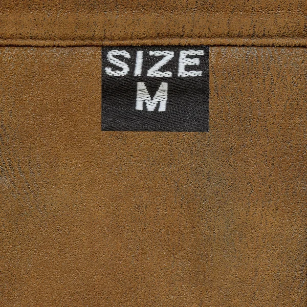 Leather texture, tag, seam — Stock Photo, Image