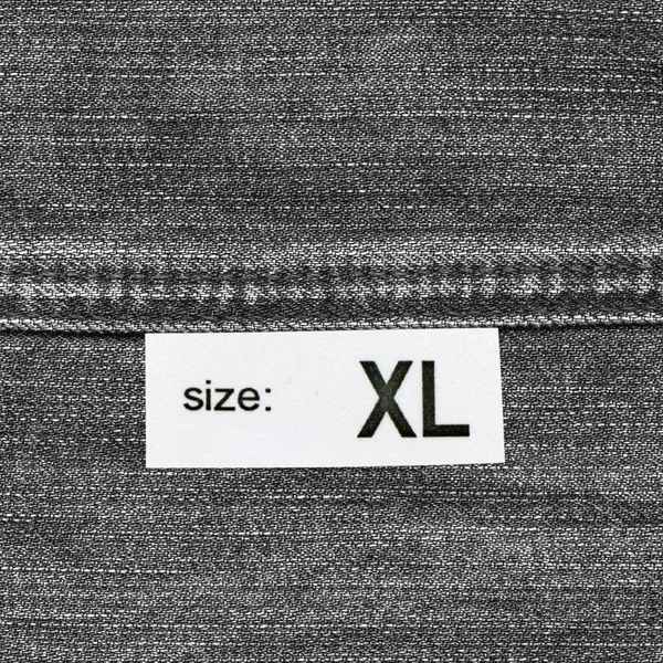 Textura de mezclilla, costura, etiqueta, tamaño — Foto de Stock