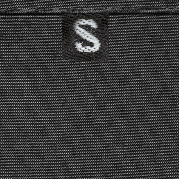 Zwarte textiel textuur en zwarte tag — Stockfoto