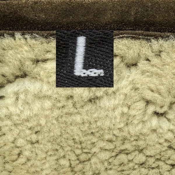 Piel de oveja primer plano, etiqueta, tamaño — Foto de Stock