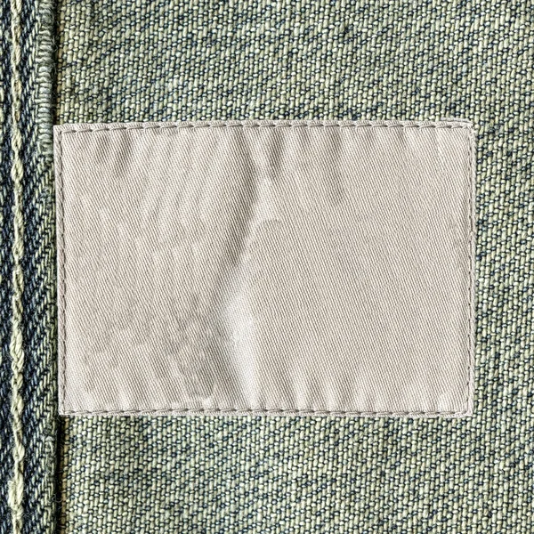 Textura denim com etiqueta — Fotografia de Stock