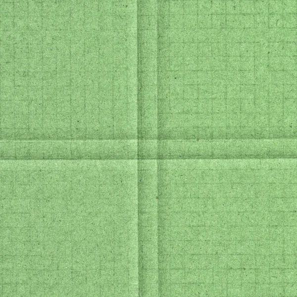 Grüner Hintergrund basierend auf Kartonstruktur, Kreuz — Stockfoto
