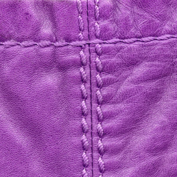 Violet leather background, seams, stitches — Stock Photo, Image