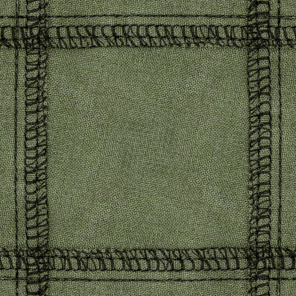 Zielony tkanina tło ozdobione szwy — Zdjęcie stockowe