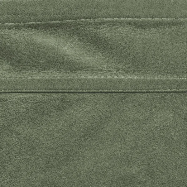 Green leather background,seams,stitches — Stock Photo, Image