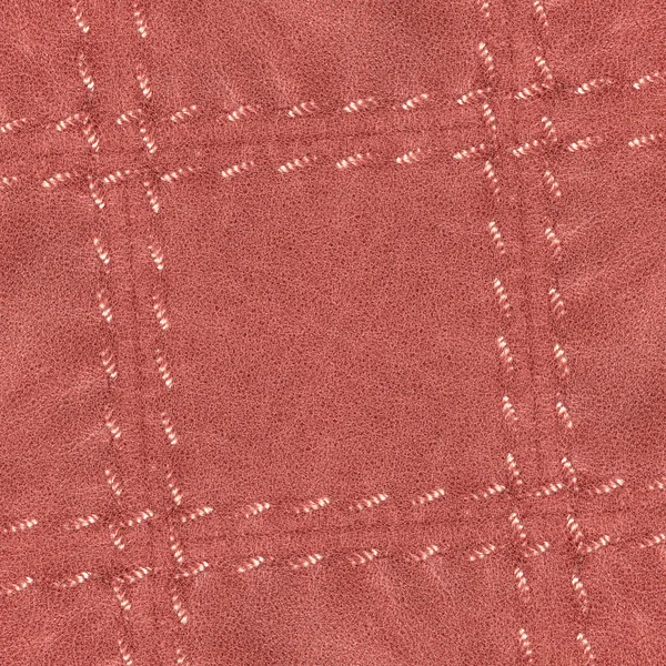 Rött läder bakgrund, stygn i form av ramen — Stockfoto
