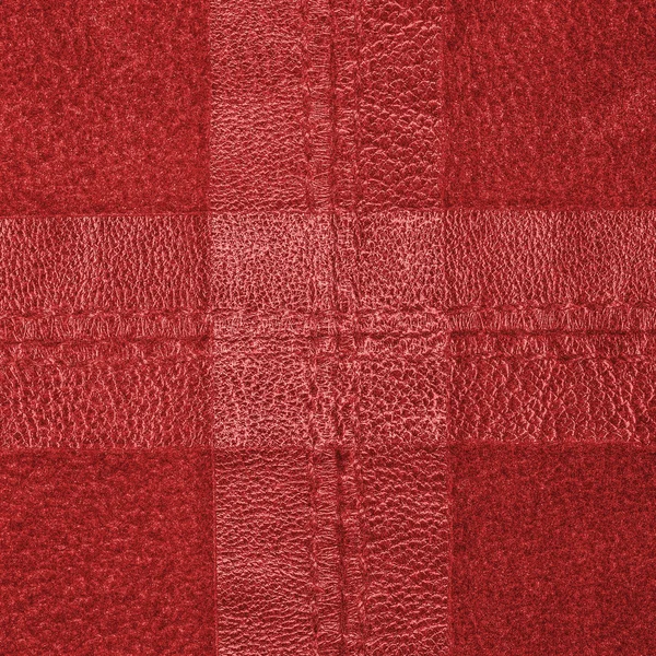 Kırmızı deri arka plan, haç şeklinde dikişleri — Stok fotoğraf