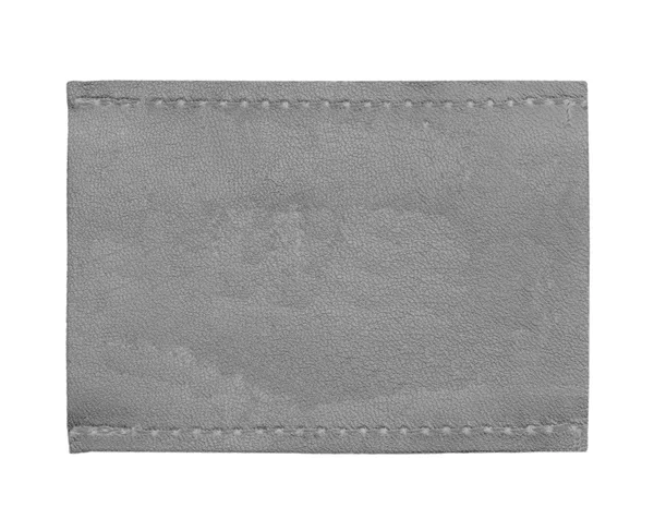 Etiqueta gris en blanco vaqueros de cuero aislado en blanco —  Fotos de Stock