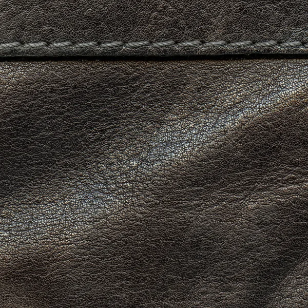 Textura de couro marrom escuro, costura, pontos — Fotografia de Stock