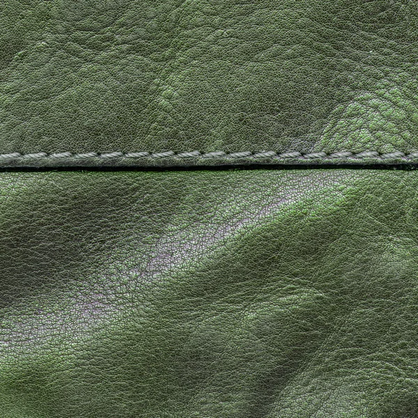 Старая зеленая кожа текстура, шов, стежки — стоковое фото