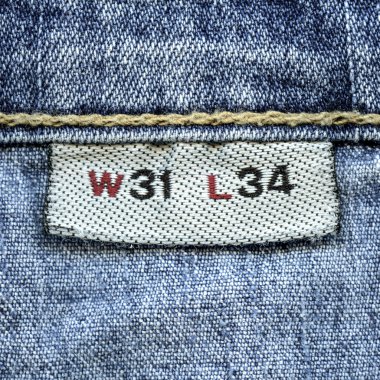 Tekstil etiket üzerindeki mavi kot arka plan