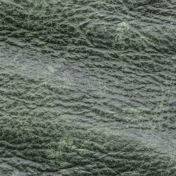 Green leather texture closeup as background — Stock Photo, Image