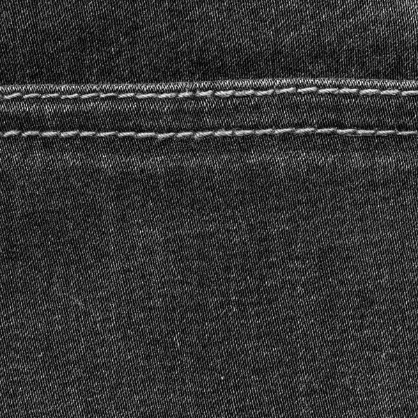 Текстура черной джинсы, украшенная швами — стоковое фото