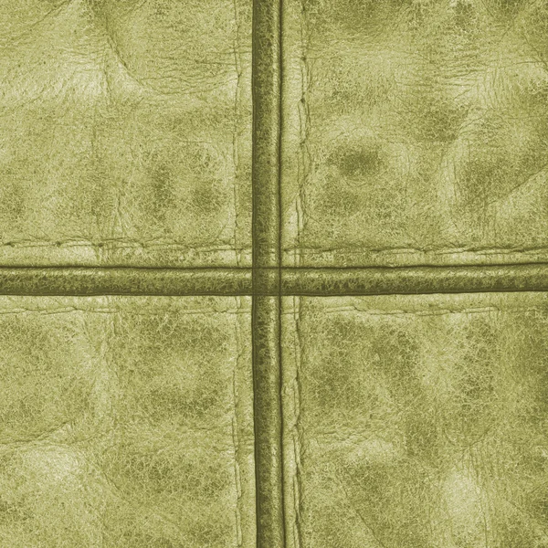 Zelené kožené pozadí s švy — Stock fotografie