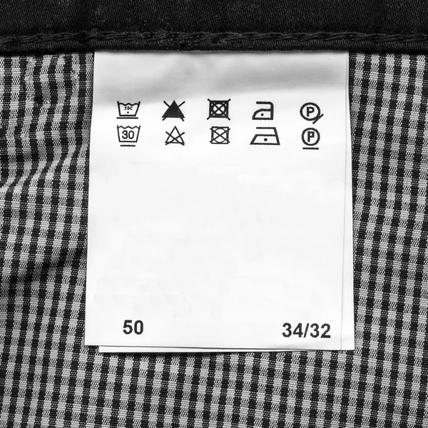 Símbolos definidos no rótulo do vestuário — Fotografia de Stock