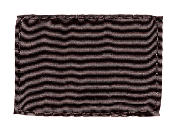 Beyaz arka plan üzerinde boş kahverengi tekstil etiket — Stok fotoğraf