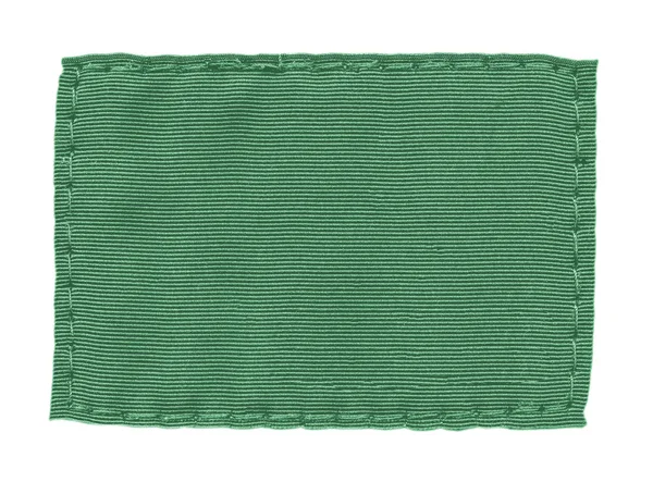 Bianco etichetta tessile verde su sfondo bianco — Foto Stock