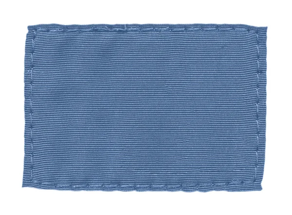 Étiquette textile bleue vierge sur fond blanc — Photo