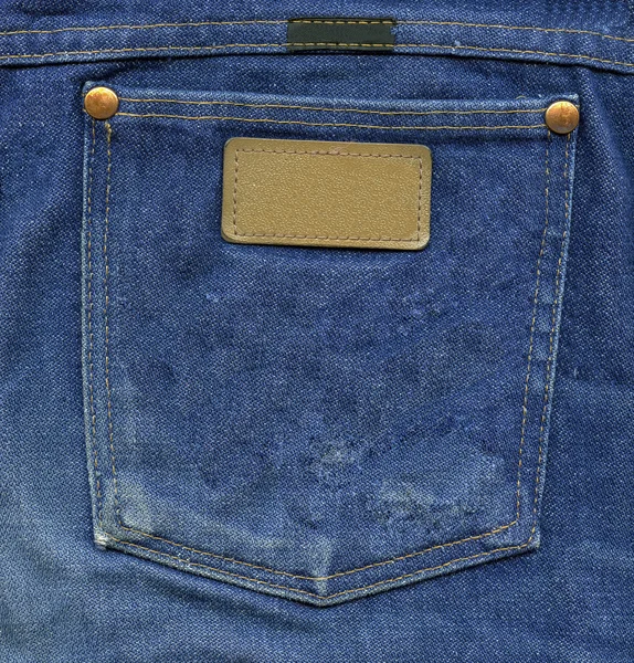 Blue jeans terug zak met label — Stockfoto