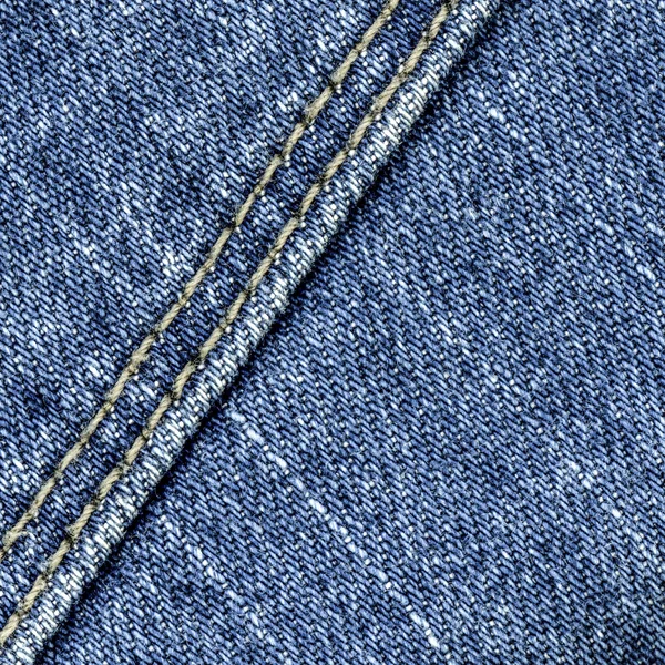 Blauwe denim textuur, versierd met naad — Stockfoto