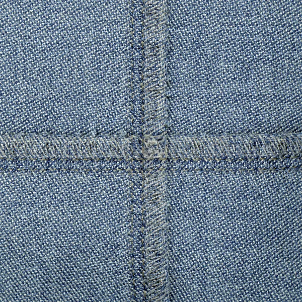 Blauwe denim textuur. Naden in de vorm van het Kruis — Stockfoto