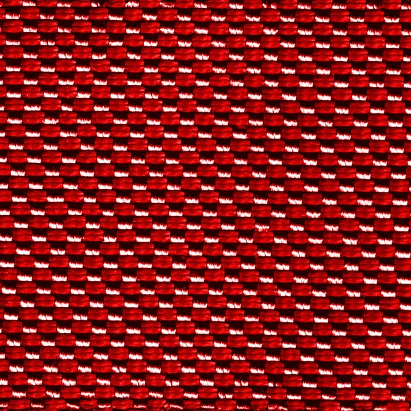 Vermelho syhthetic material textura closeup como fundo — Fotografia de Stock