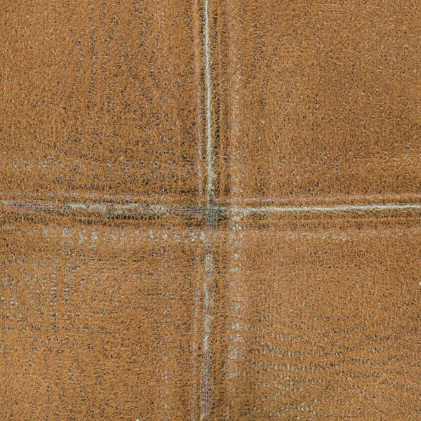 Коричневый кожаный фон со швами — стоковое фото