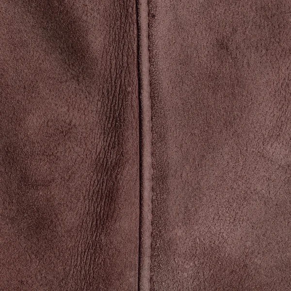 Brown leather texture decorated with seam — Stock Photo, Image