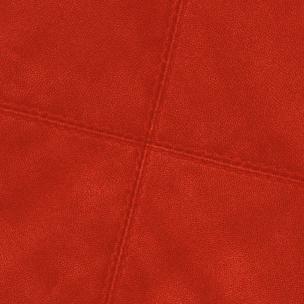 Piros bőr háttér, a kereszt alakú varratok — Stock Fotó