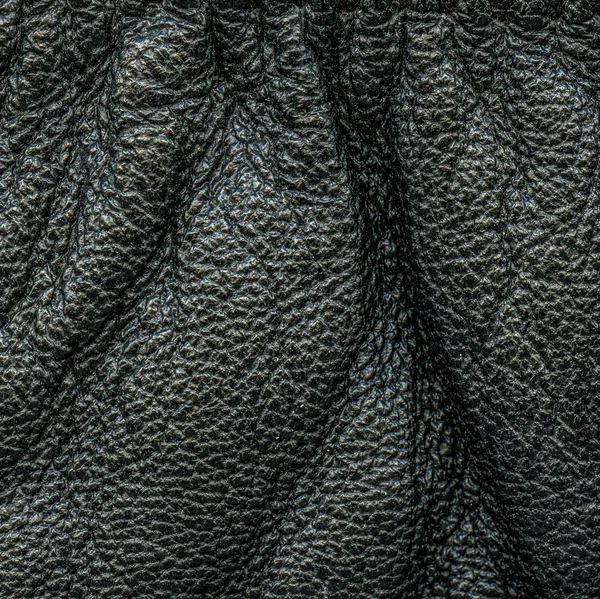 Black wrinkled leather closeup — Stock Photo, Image