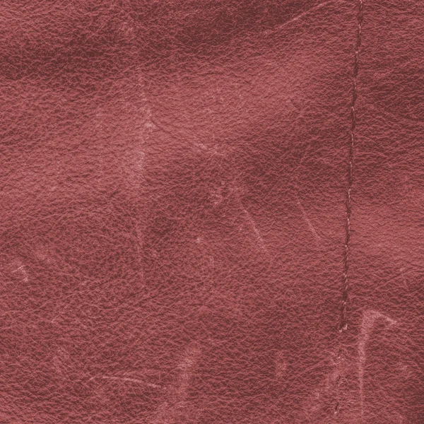 Eski ve yıpranmış kırmızı deri arka plan, eski dikiş — Stok fotoğraf