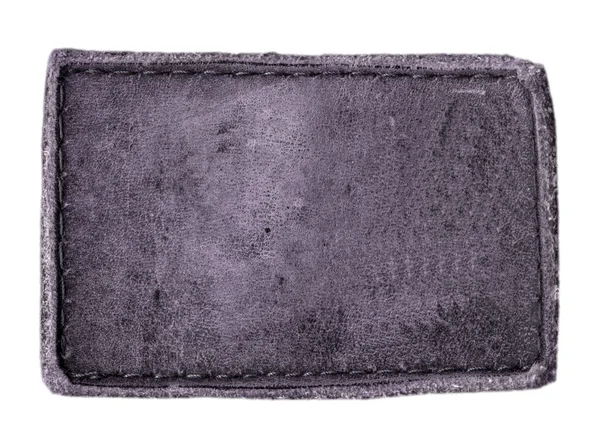 Etiqueta de couro violeta antigo isolado no fundo branco — Fotografia de Stock