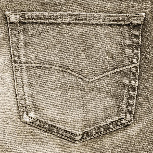 Brown jeans pocket closeup on brown jeans background — Stock Photo, Image