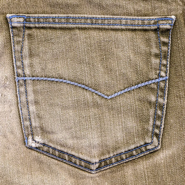 Brown jeans pocket closeup on brown jeans background — Stock Photo, Image