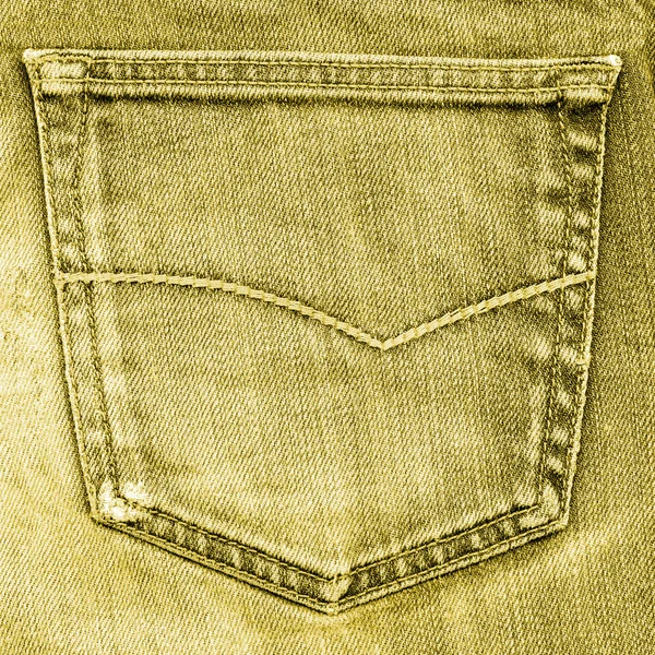 Yellow jeans pocket closeup on jeans background — Stock Photo, Image