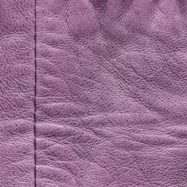 Фиолетовая кожа текстура, шов. Может использоваться в качестве фона — стоковое фото