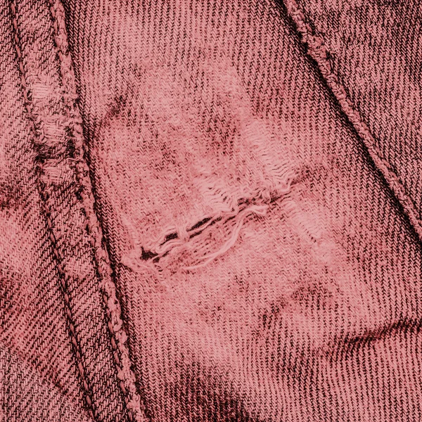 Detail of torn red  denim — Stock Photo, Image